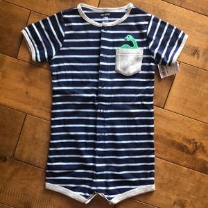 New Carter’s one piece with dinasoar.  24M